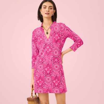 Woman wearing a printed pink dress